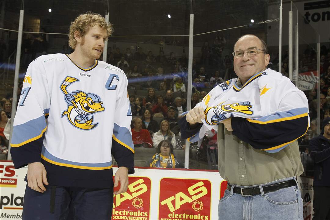 Walleye-captain-Matt-Krug-gives-Mike-Navarre-a-jersey