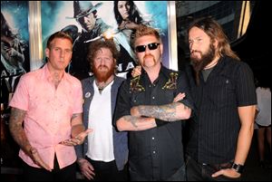 Musicians Brann Dailor, Brent Hinds, Bill Kelliher and Troy Sanders of Mastodon arrive at the premiere of Warner Bros. 