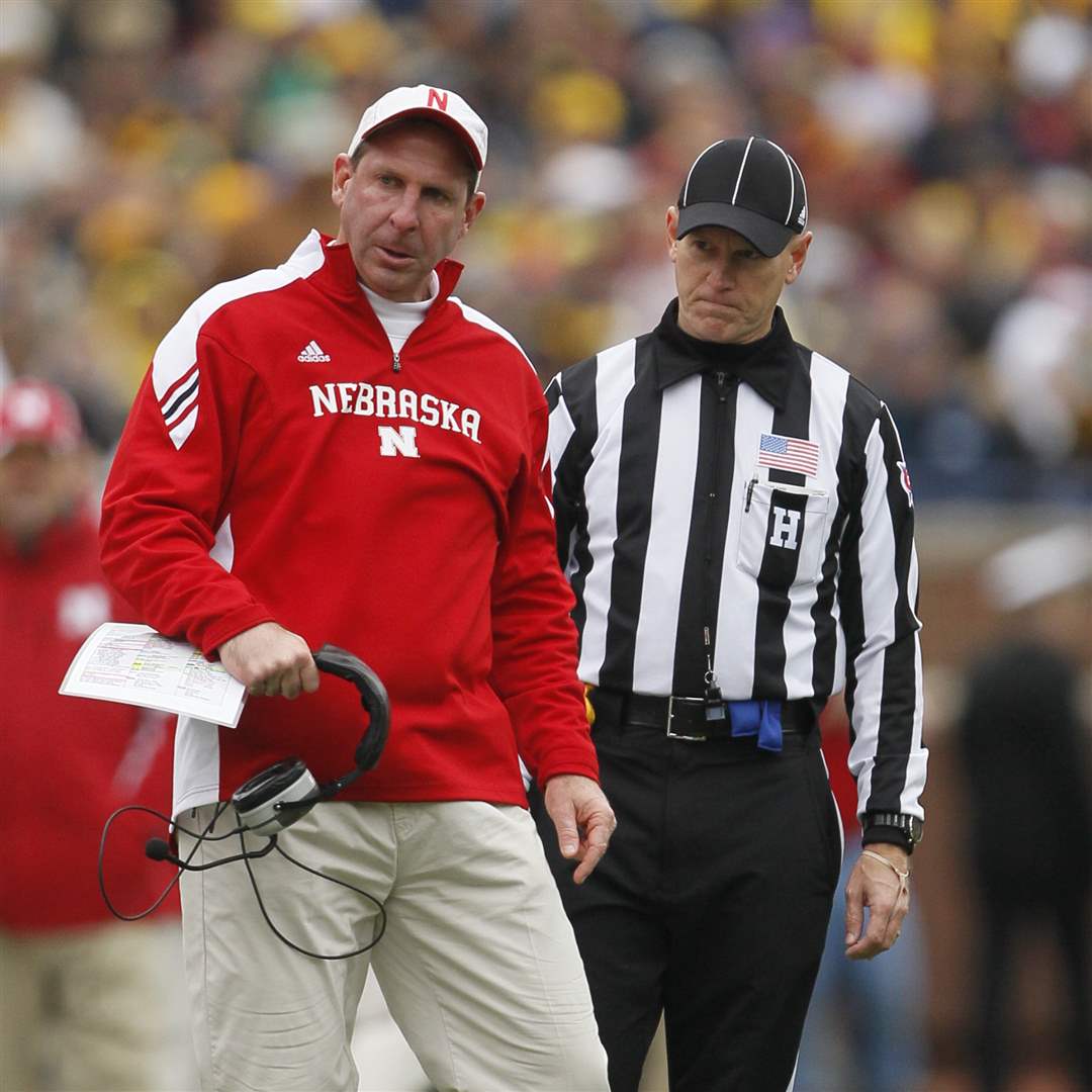 Nebraska-Cornhuskers-head-coach-Bo-Pelina-turns-away-from-a-referee