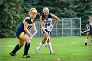 Maumee Valley's Audrey White (14) vies for the ball against a player from Saline, Mich. White, a junior, was the Hawks second leading scorer.