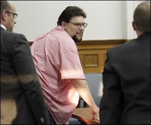 Geoffrey Dupuis  stands after the reading of his verdict in Lucas County Common Pleas Court.