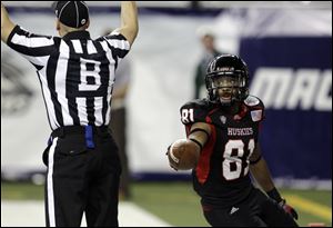 Northern Illinois wide receiver Nathan Palmer (81) looks back to the referee as he scores a touchdown during the fourth quarter of an NCAA college football game against Ohio in Detroit, Friday. Palmer scored two touchdowns in the Huskies' 23-20 win over Ohio.