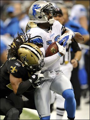 Detroit's Nate Burleson says the Lions need to 'learn how to walk the other way because the microscope is on us.'