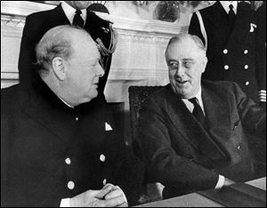 Prime Minister Winston Churchill, left, and President Franklin D. Roosevelt face each other at a conference table in the White House at Washington, Dec. 22, 1941.