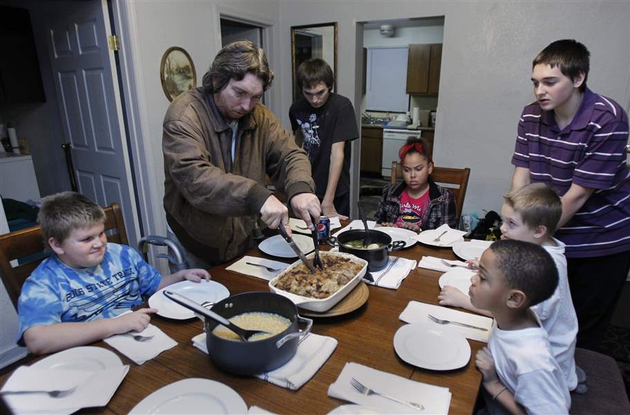 The-Johnson-eat-dinner-in-their-new-Locus-Street-home