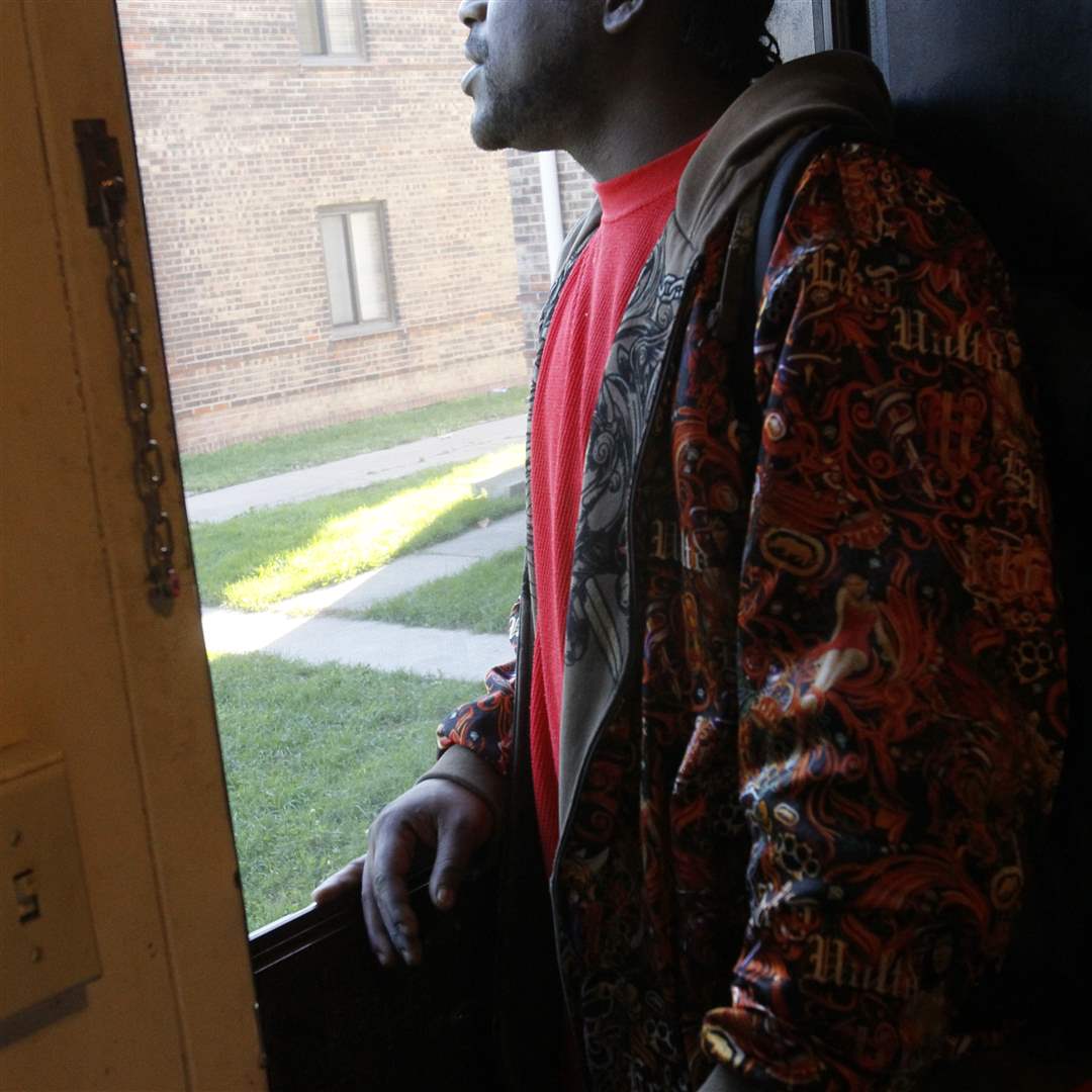 lionel-patrick-looks-out-window