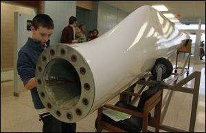 Sixth grader Josh Meinke picked a spot at the end of the blade that will be attached to the tower so he could 