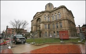 Protesters worried that costly proceedings would hurt Seneca County have dropped a lawsuit to try and save the 1884 courthouse.