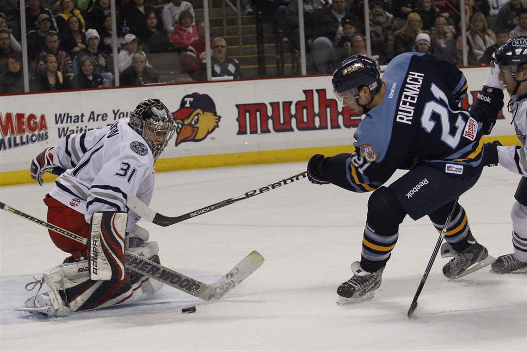 Chicago-goalie-Paul-Dainton-blocks-a-shot-by-Walleye-s-Bryan-Rufenach-1