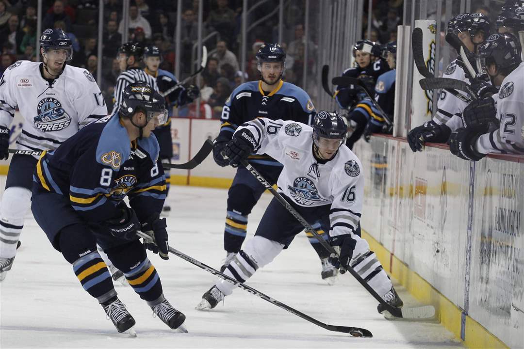 Walleye-s-Gleason-Fournier-and-Chicago-s-Mike-Embach-fight-for-the-puck