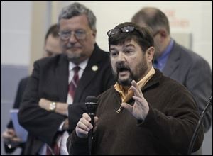 Toledo City Councilman Mike Craig responds to Brenda Hagman about why he hasn't responded to her emails during a town hall meeting at the East Toledo Family Center.