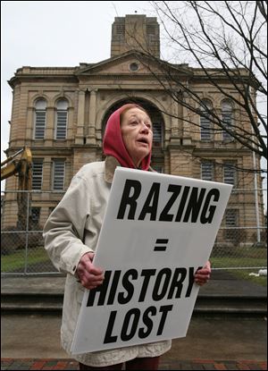 Mary McCall of the Tiffin Historic Trust is against demolition of  Seneca County's 1884 courthouse Friday, in Tiffin, Ohio.