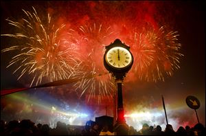 Fireworks explode in the sky over Bucharest, Romania, at midnight, Sunday, during street celebrations of the new year. Large crowds gathered downtown Romania's capital taking advantage of the dry weather to attend the celebrations.