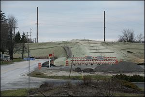 Earthen embankments for the Hallett Avenue bridge over the Norfolk Southern Corp. railroad tracks in Swanton are in place.