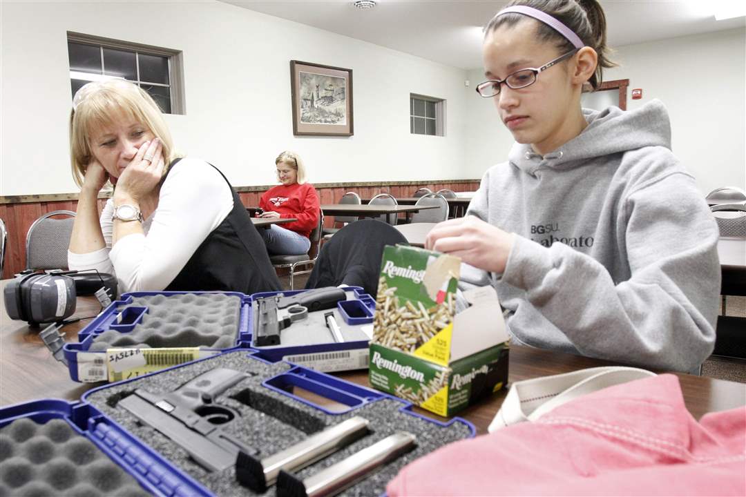 women-firearms-Denise-Quinn-Lauren-Wolfe-loading-gun