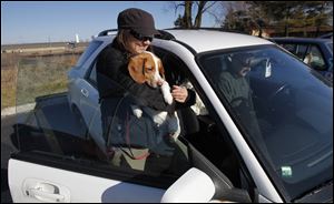 Beverly Hills, Mich. resident MJ Murphy will hold one of the six dogs she and her husband Mike will transport.
