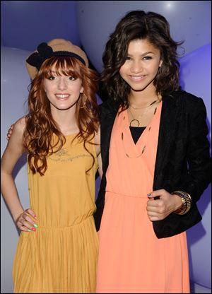 Actors Bella Thorne, left, and Zendaya Coleman attend the Disney Kids and Family Upfront in New York.