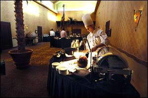 A chef prepares dinner at the NIA Center, at the Kalahari Resort, in Sandusky, Ohio. Kalahari is expanding the conference center by 120,000 square feet.
