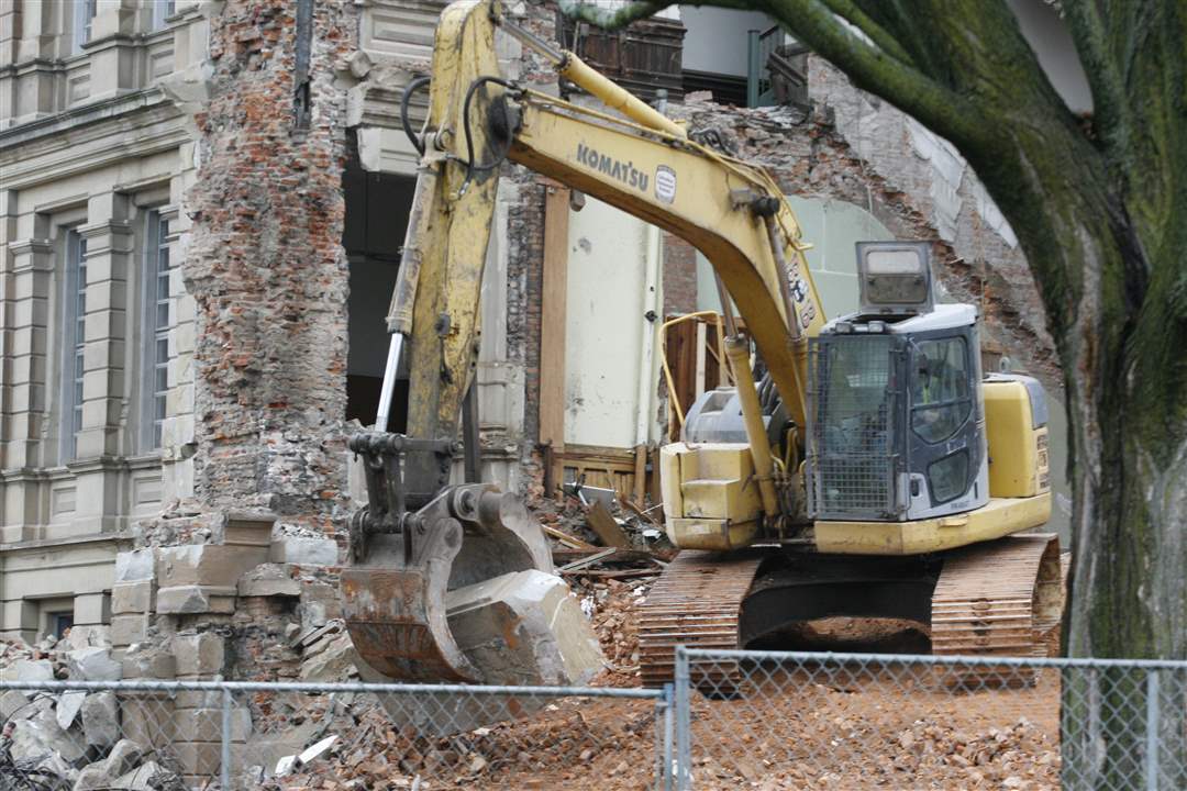 excavator-carries-cornerstone