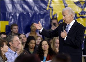 Vice President Joe Biden answers questions from the crowd during an event to discuss college affordability at Lincoln High School in Gahanna, Ohio. Biden talked about the high cost of a college education and the Obama administration's efforts to make it more affordable. 