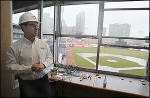 Ray Benjamin of the Lathrop Company gives a tour of the demolition of the press box. Construction is expected to be done before the exhibition against the Detroit Tigers.