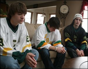  Clay High School hockey team members Anthony Csizek, left, Logan Myers, and Hudson Sabin gather to remember Cody Van Hersett. 'He was the littlest guy on our team, but he took on the biggest person on the opposing team,' Logan, 17, of Oregon, said Friday. 
