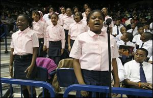 Najae' Pettaway, 10, and classmates from the Ella P. Stewart Academy for Girls in Toledo, recite an MLK pledge during the 11th annual Dr. Martin Luther King Jr. Unity Celebration in Savage Arena at the University of Toledo, Monday, January 16, 2012. Boys from the Martin Luther King, Jr. Academy for Boys also recite a pledge.