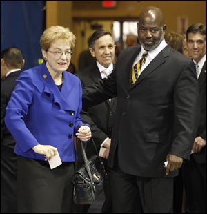 From left, Rep. Marcy Kaptur, Rep. Dennis Kucinich, and Toledo Mayor Mike Bell attend a Martin Luther King, Jr., unity celebration in Savage Arena at UT. Miss Kaptur and Mr. Kucinich face each other and Graham Veysey in a 9th Congressional District Democratic primary.