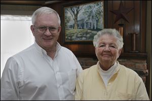 Lee and Barb Irons have lived near the  tracks nearly 45 years. 'You almost  have to talk between trains,' Mrs. Irons says.