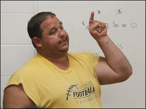 Jerry Bell, shown here at Whitmer's first practice in August 2011, has been named head coach.