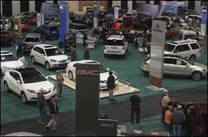 The floor is full of new cars at the 2011 Greater Toledo Auto Show.