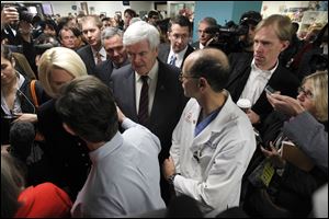 Republican presidential candidate Newt Gingrich, center, and his wife Callista visit Children's Hospital on Friday in Charleston, S.C. 