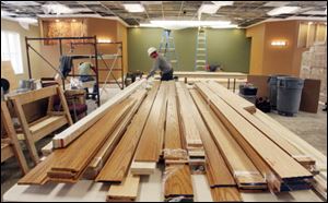 Volunteers are busy getting a former insurance office near downtown Toledo ready to open next month as Midtown Kingdom Hall.