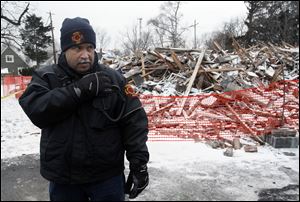 Fire Chief Luis Santiago, outside the West Toledo apartments, says every floor of the building was searched.