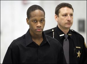 Michael Taylor III arrives at  Lucas County Common Pleas Court in Toledo.  He is charged with murder for the shooting death of Darrin Smith in April 2010.
