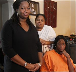 Sandra Brown, left, Delano Fleming’s sister, with June Galloway, his mom, and Franchesca Fleming, another sister, says the family questions how thoroughly the fire department searched the building.