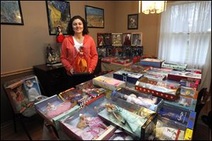 Kelly Peffley collects Barbie dolls.