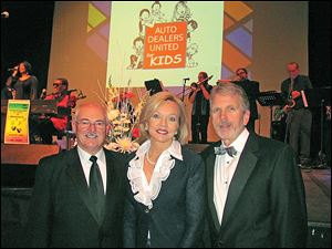 Gala chairman Marianne Ballas, center, with committee members Pat Stark and John Yark.