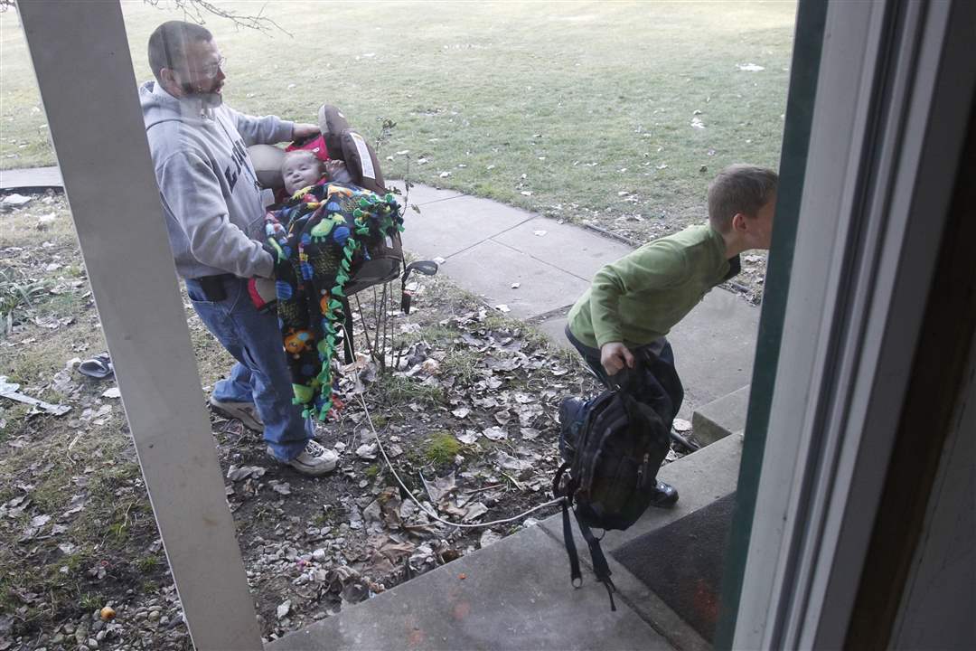 tenney-carries-his-son-1