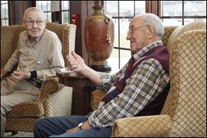 Mr. Garner, right, talks of being the son of a volunteer pastor at Black Swamp Church of the Bretheren, now Lakewood Church of the Bretheren.