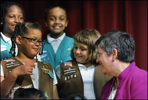 Department of Homeland Security Secretary Janet Napolitano talks with Girl Scouts Amya Hurley, left, and Brooke Hunley after unveiling a Girl Scout preparedness patch in Laurel, Md., in this Sept. 8, 2008 file photo.