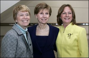 Milestone award winners from left;  Betsy Brady, Anne Baker, Mari Davies, pose Tuesday, March 23, 2010, at the SeaGate Centre in Toledo, Ohio.