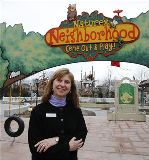 Toledo Zoo executive director Anne Baker outside Nature's Neighborhood, one of her favorite habitats at the zoo.