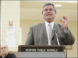 Ted Magrum, superintendent of Bedford Schools, addresses about 100 people, most of them district employees, at Thursday's session. 
