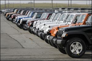 Toledo-built Jeep Wranglers -- lined up in the lot at Chrysler's North Assembly plant in North Toledo -- gained 23 percent from last January, with sales of 7,896. The Jeep Liberty was another big performer.