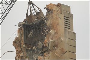 Crews take down the the clock tower of the Seneca County Courthouse.