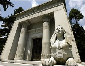 A sphinx stands outside the Woolworth Mausoleum at the Woodlawn Cemetery in the Bronx, where burial can cost more than $1 million. 