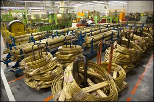 Coils of brass are stacked inside the Master Lock company in Milwaukee, Wis. 