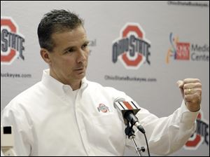 Ohio State football coach Urban Meyer answers questions from reporters during an NCAA college football national signing day event on  Feb. 1.
