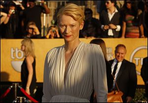 Tilda Swinton arrives at the 18th Annual Screen Actors Guild Awards show at the Shrine Auditorium in Los Angeles, California.